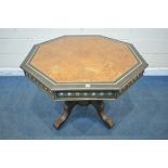 A MID TO LATE 19TH CENTURY EBONISED AND AMBOYNA OCTAGONAL CENTRE TABLE, with brass and porcelain