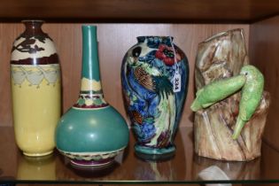 A GROUP OF FOUR VASES, comprising a Thomas Forrester Trogon Ware vase tube lined with an exotic bird