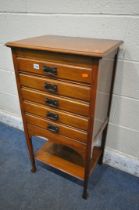 AN EDWARDIAN WALNUT FIVE DRAWER MUSIC CABINET, width 51cm x depth 37cm x height 95cm (condition