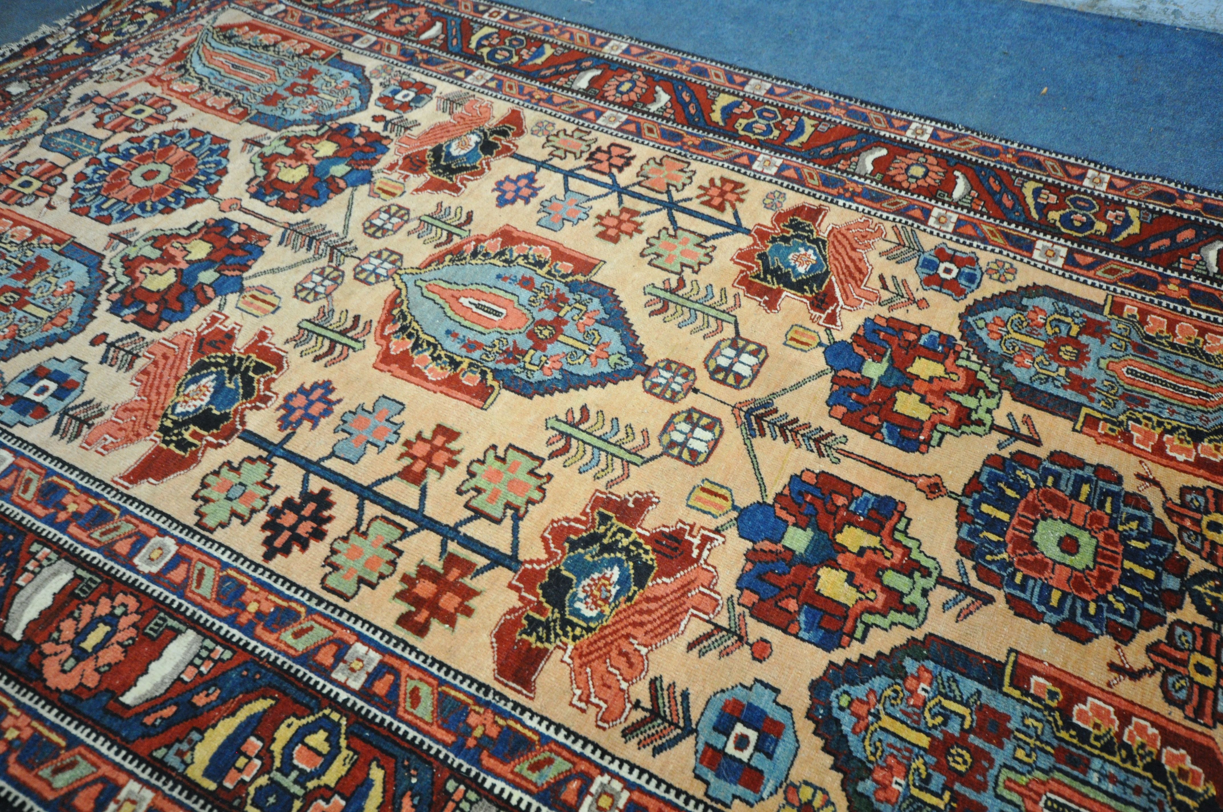 A PERSIAN MALAYER RUG, hand knotted with a repeating stylized pattern on a cream field, and - Image 4 of 7