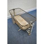 A VICTORIAN METAL FOLDING TRAVEL ROCKING CRIB (condition report: loose rope, some rust, losses to