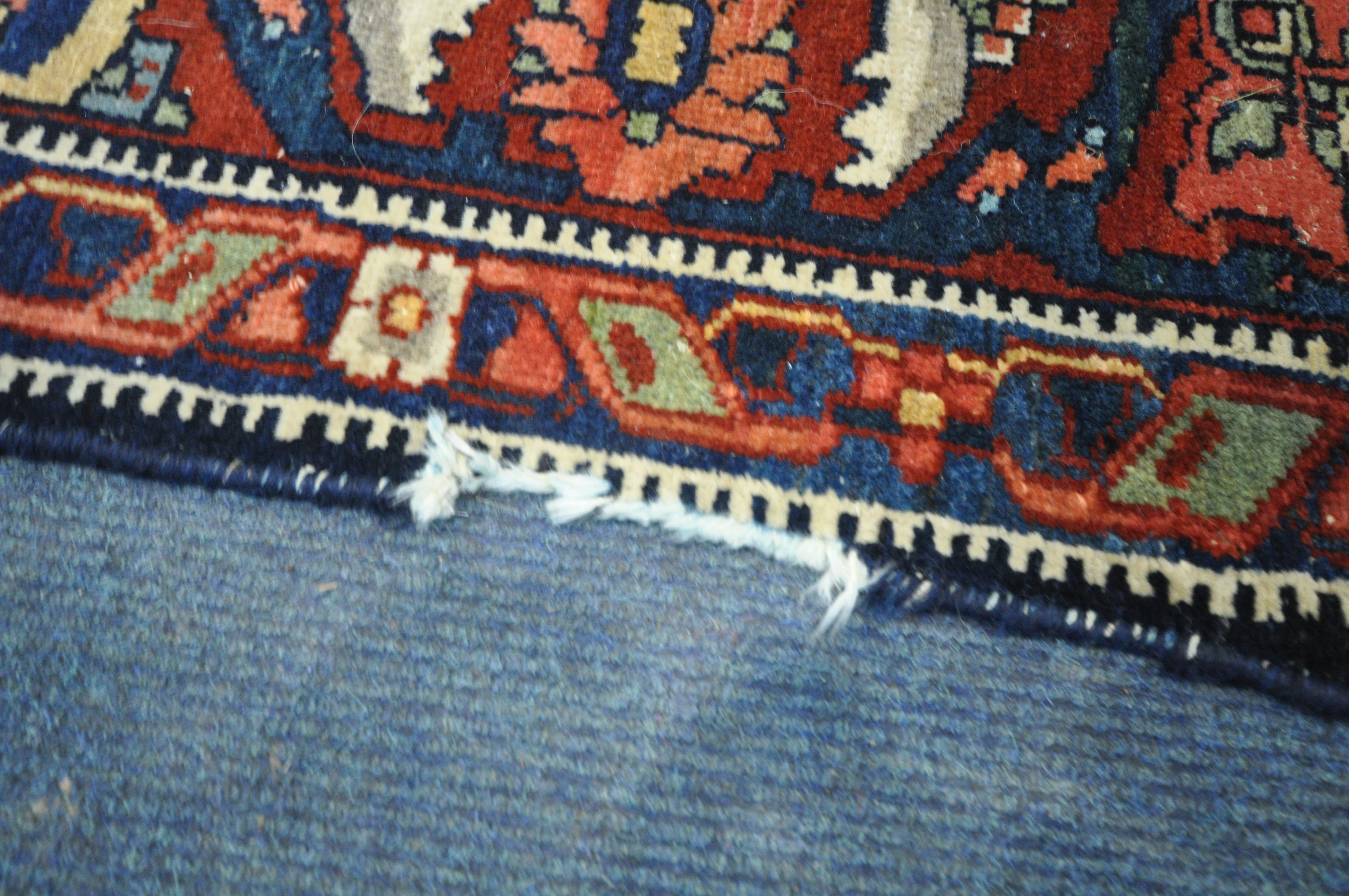 A PERSIAN MALAYER RUG, hand knotted with a repeating stylized pattern on a cream field, and - Image 6 of 7