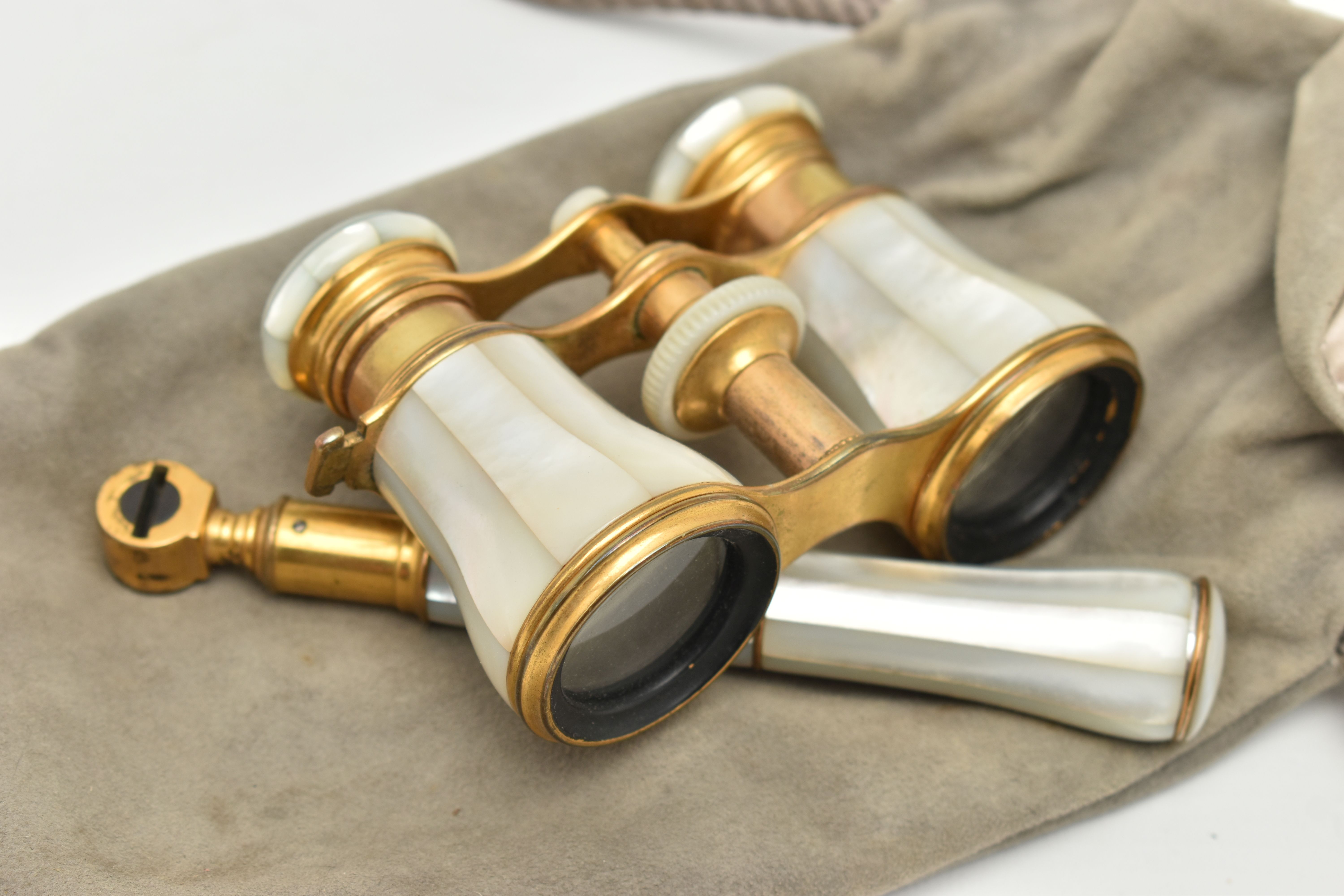 A PAIR OF BRASS AND MOTHER OF PEARL OPERA GLASSES, signed to the lens frames 'Lemaire Fabi Paris'