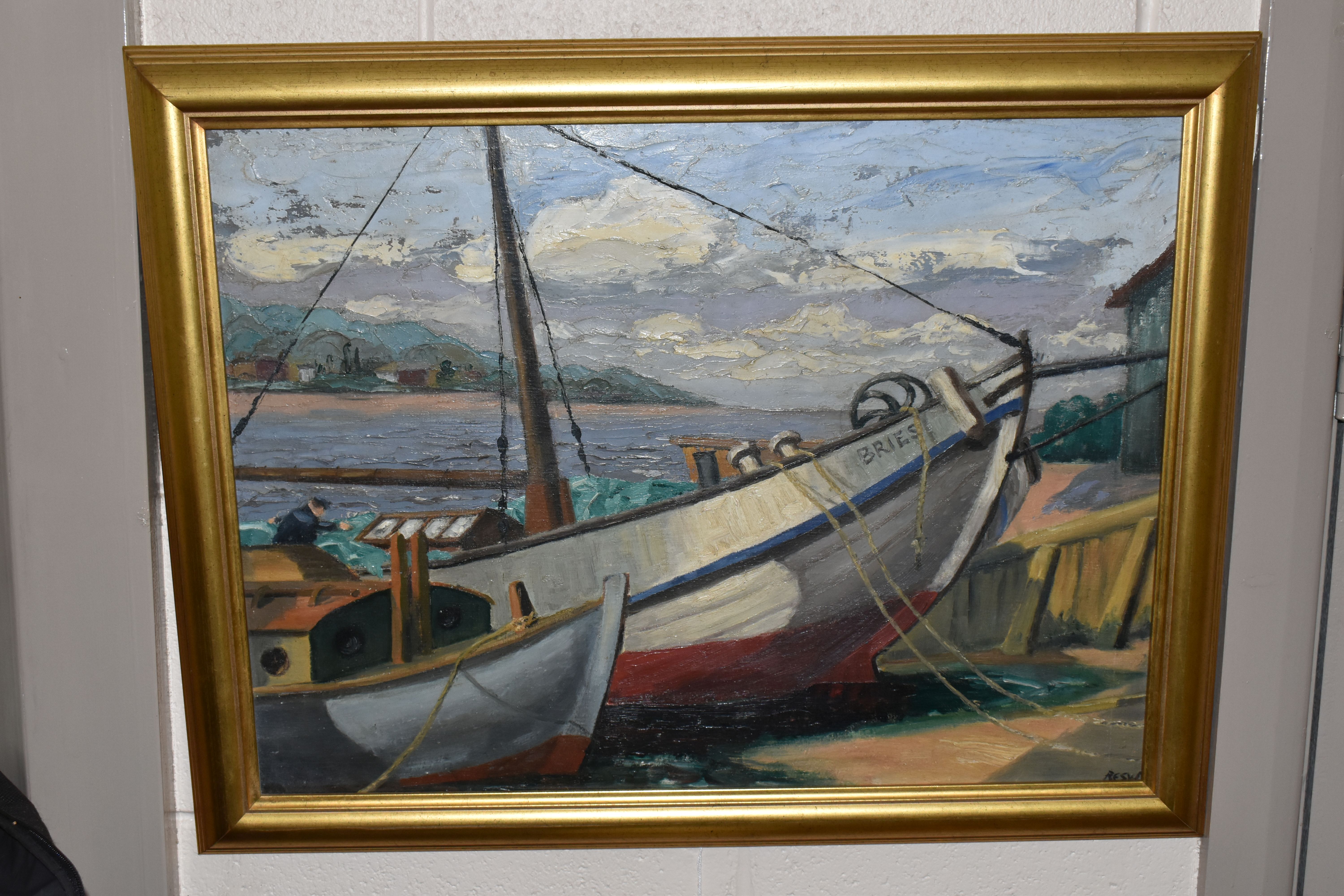 A 20TH CENTURY FISHING BOAT SCENE, two boats are beached at low tide while a male figure tends to