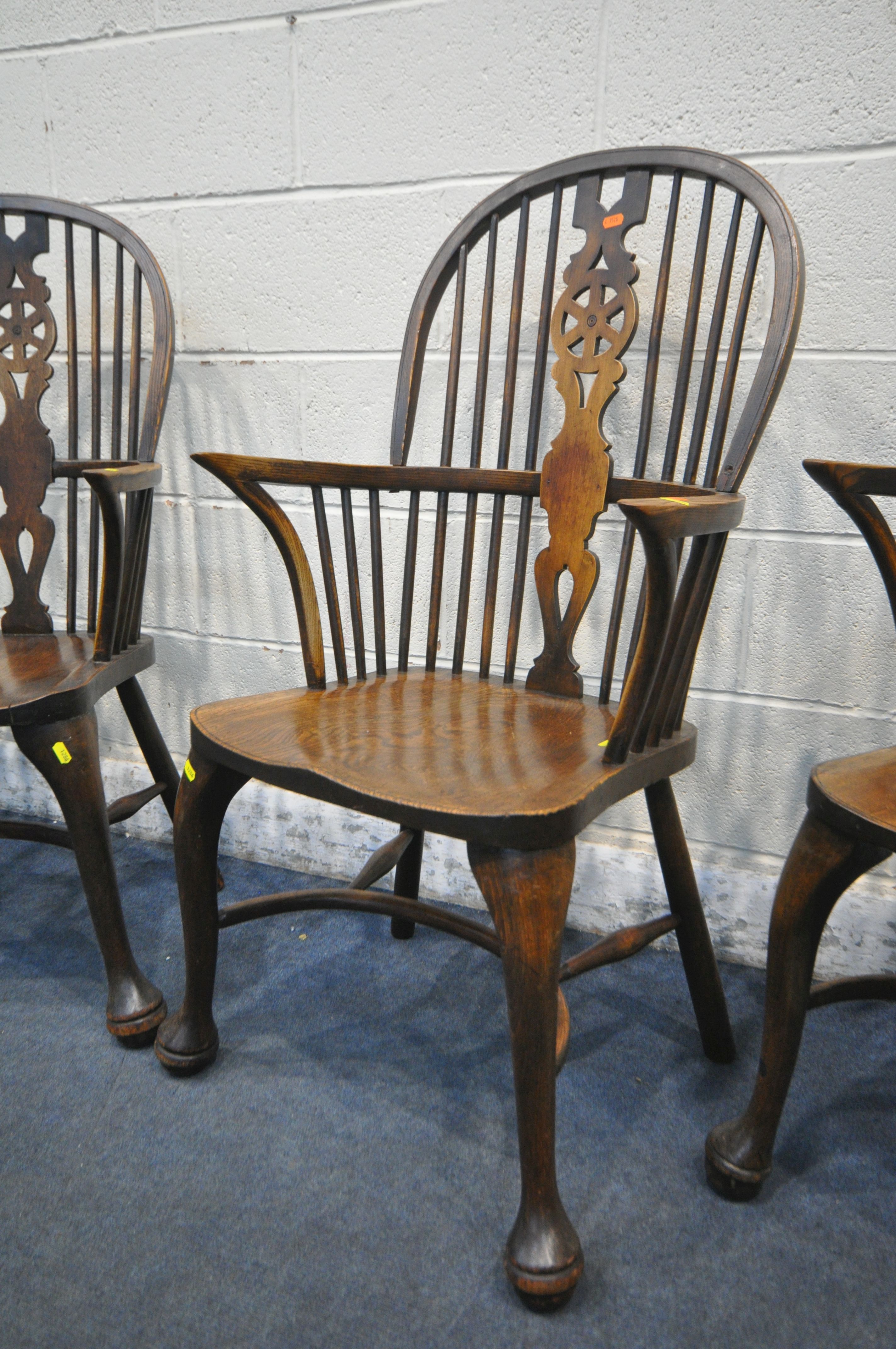 A SET OF FOUR EARLY 20TH CENTURY ELM AND BEECH HOOP BACK WINDSOR ARMCHAIR, with a wheel splat - Image 6 of 7