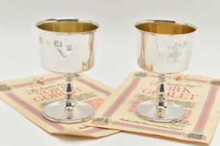 A PAIR OF ELIZABETH II SILVER GOBLETS, polished cups engraved with a family crest inscribed 'A.D.