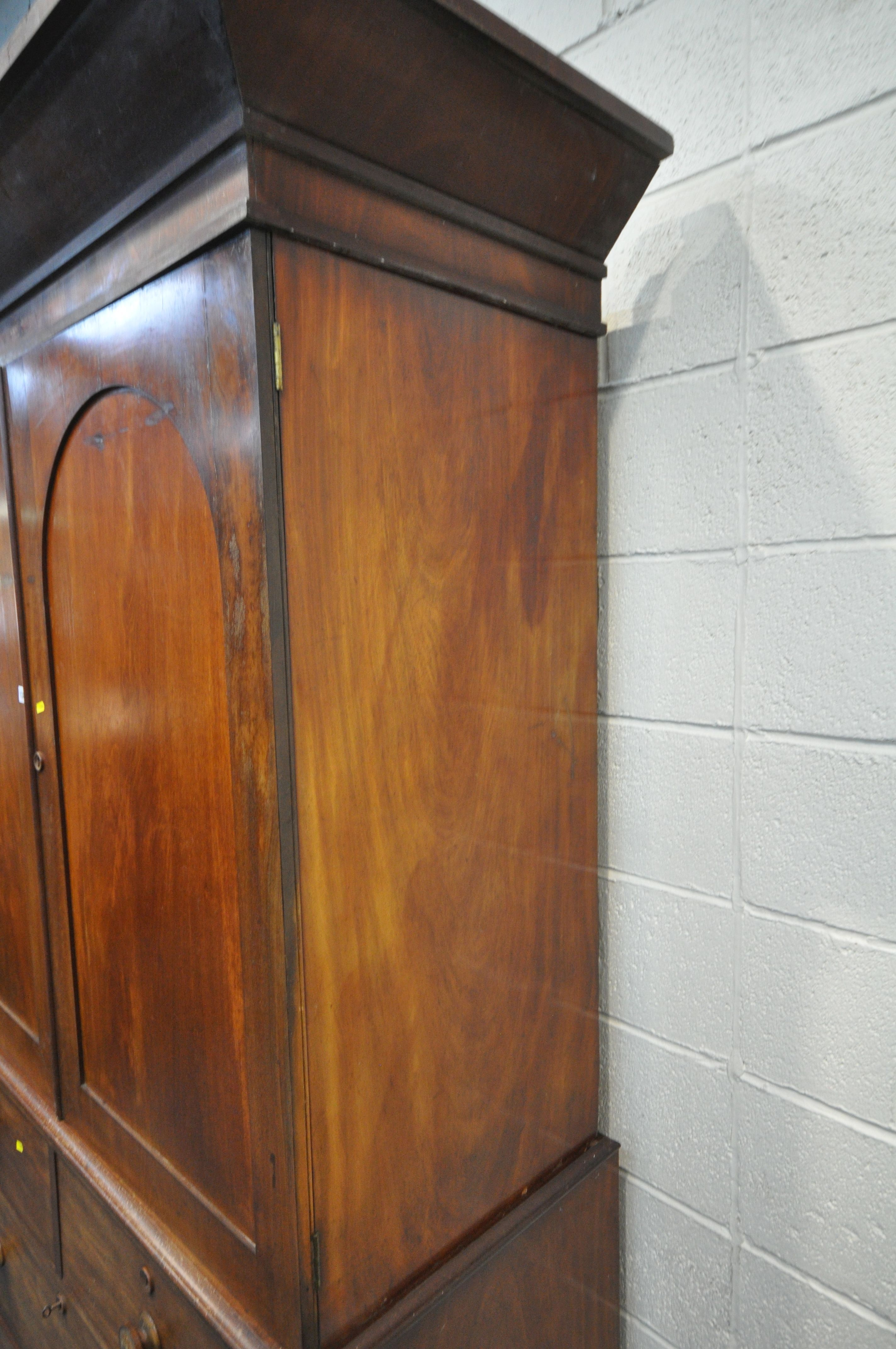 A 19TH CENTURY MAHOGANY LINEN PRESS, with a loose overhanging cornice, the double doors enclosing - Image 5 of 6