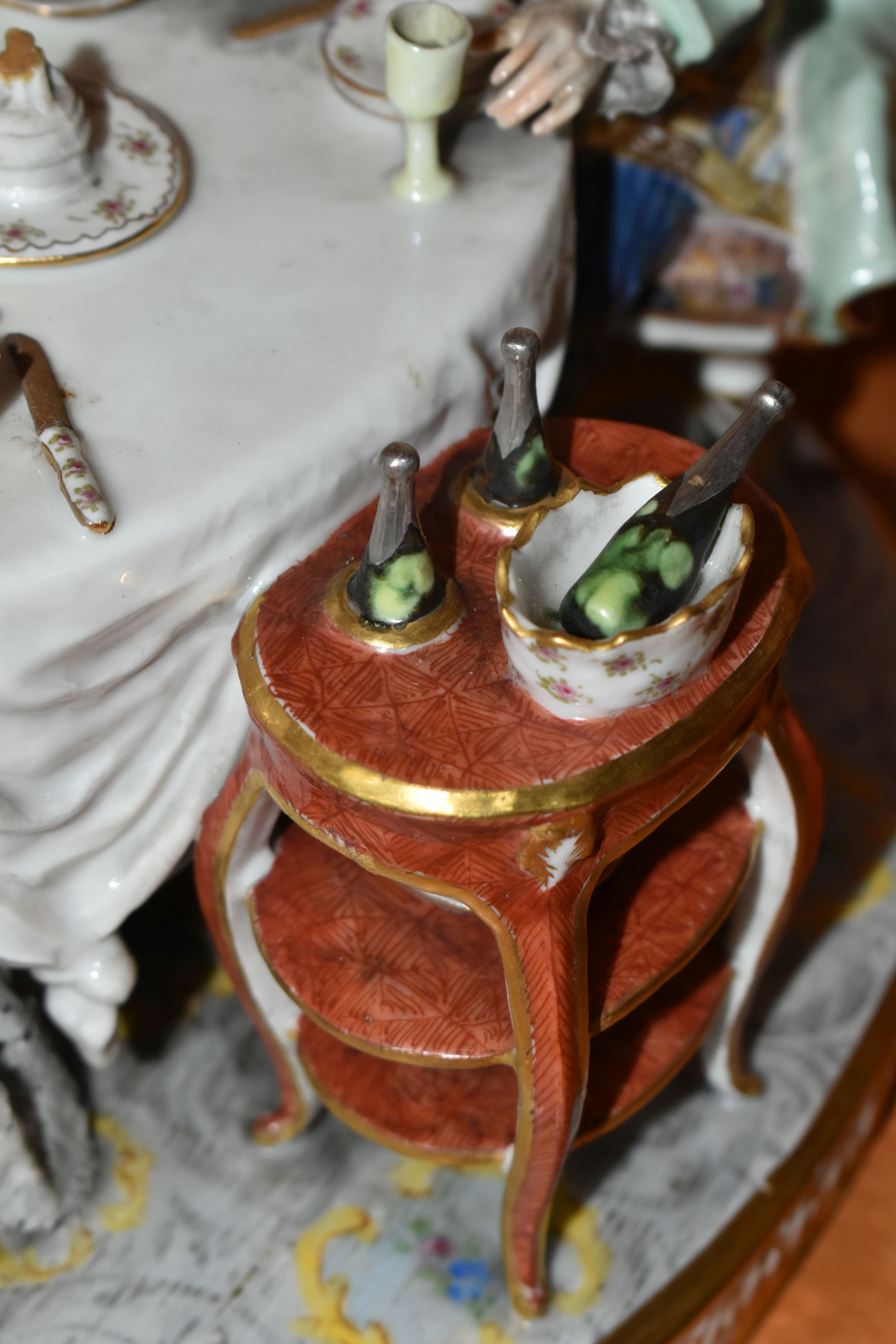 A 19TH CENTURY PARIS PORCELAIN FIGURE GROUP OF FIVE 18TH CENTURY FIGURES AROUND A DINING TABLE, with - Image 8 of 9