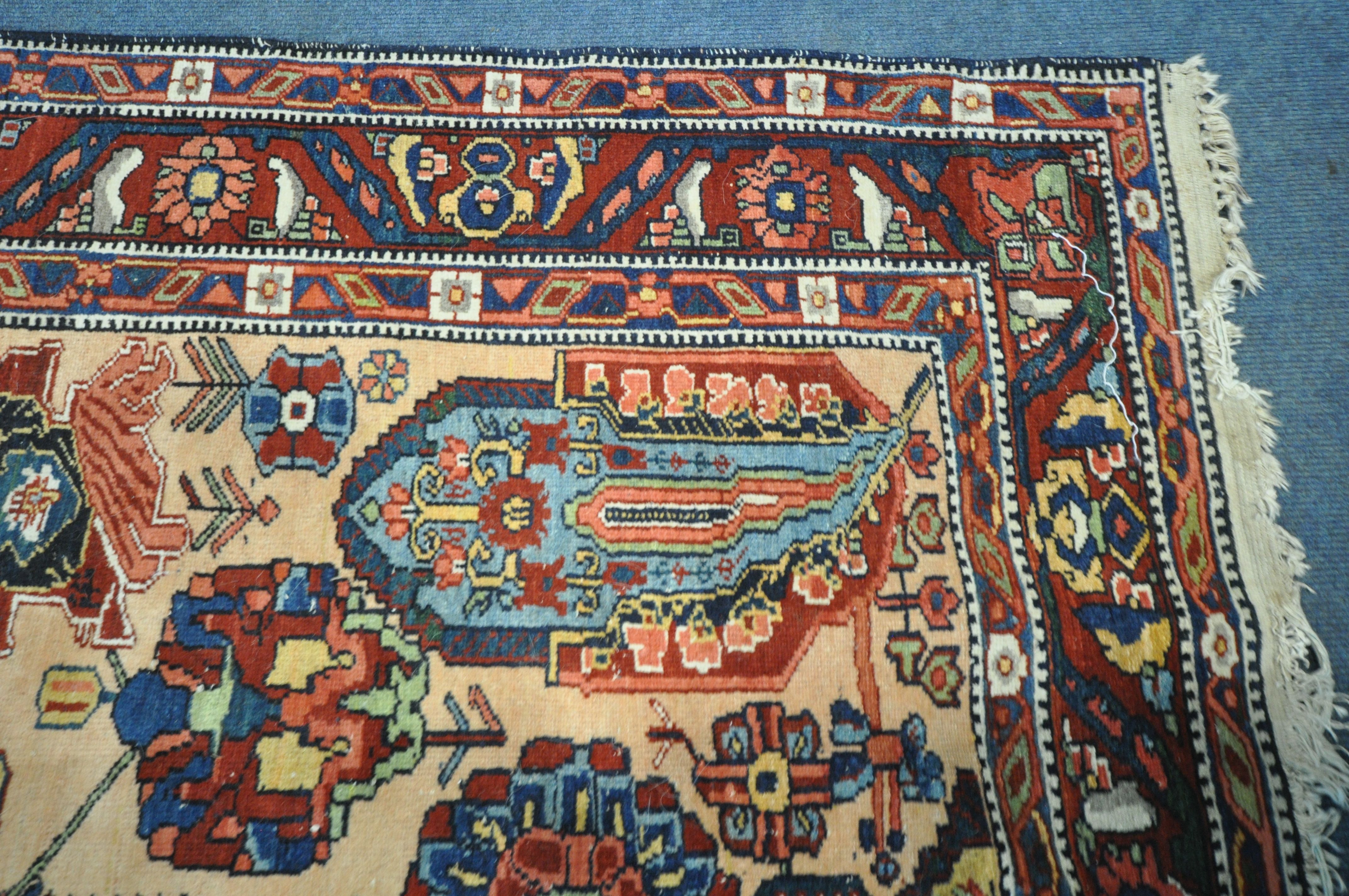 A PERSIAN MALAYER RUG, hand knotted with a repeating stylized pattern on a cream field, and - Image 3 of 7