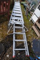 A TITAN ALUMINIUM DOUBLE EXTENSION LADDER with 15 rungs to each 410cm length, a stand off and a step