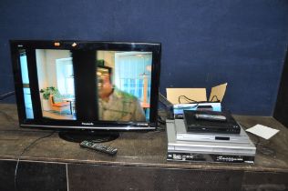 A PANASONIC TX-L32X15B 32in TV WITH REMOTE, a Sharp DVD/ Video player, a Philips DVD player and a