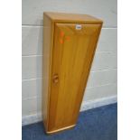 LUCIAN ERCOLANI, AN ERCOL MID-CENTURY ELM AND BEECH SINGLE DOOR BOOKCASE / CD RACK, with three