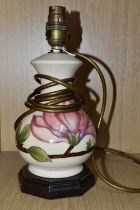 A MOORCROFT POTTERY 'MAGNOLIA' PATTERN TABLE LAMP BASE, tube lined with pink magnolia flowers on a