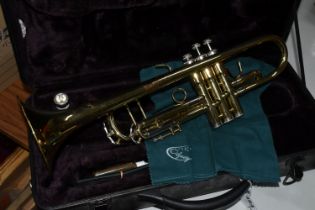 A CASED ODYSSEY TRUMPET, appears in good condition but has some tarnish and rusting to brightwork,