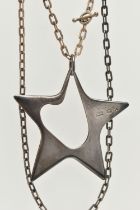 A GEORG JENSEN SILVER STAR PENDANT, an abstract star designed by 'Henning Koppel', approximate width