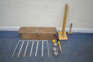 QUAIFE AND LILLEY LTD, A VINTAGE CROQUET SET, comprising four mallets, four balls, six hoops, one
