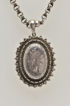 A LATE 19TH CENTURY LOCKET AND CHAIN, a large white metal oval locket, etched detail depicting a