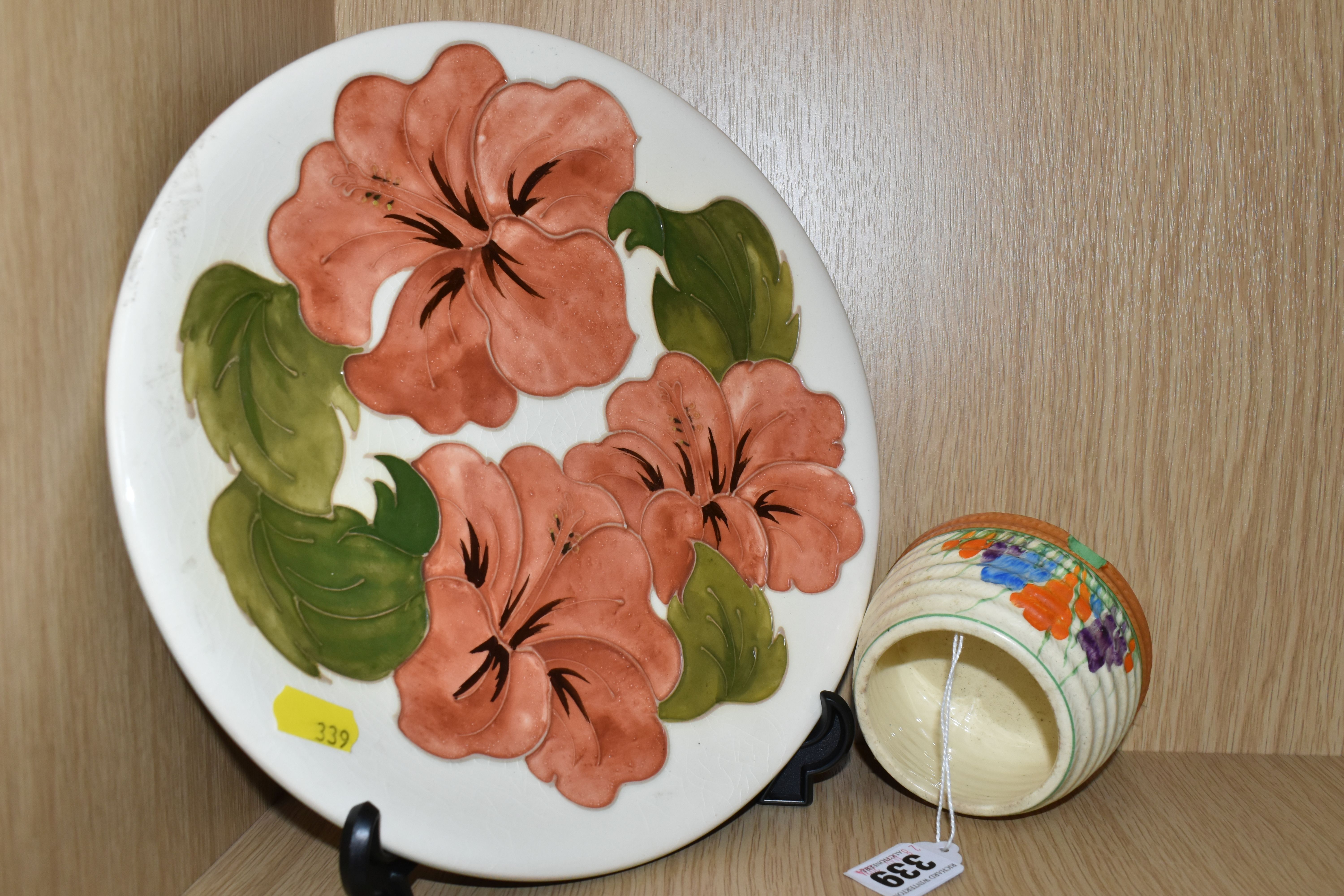A MOORCROFT POTTERY 'HIBISCUS' PATTERNED PLATE AND A CLARICE CLIFF SUGAR BOWL, comprising a coral - Image 3 of 4