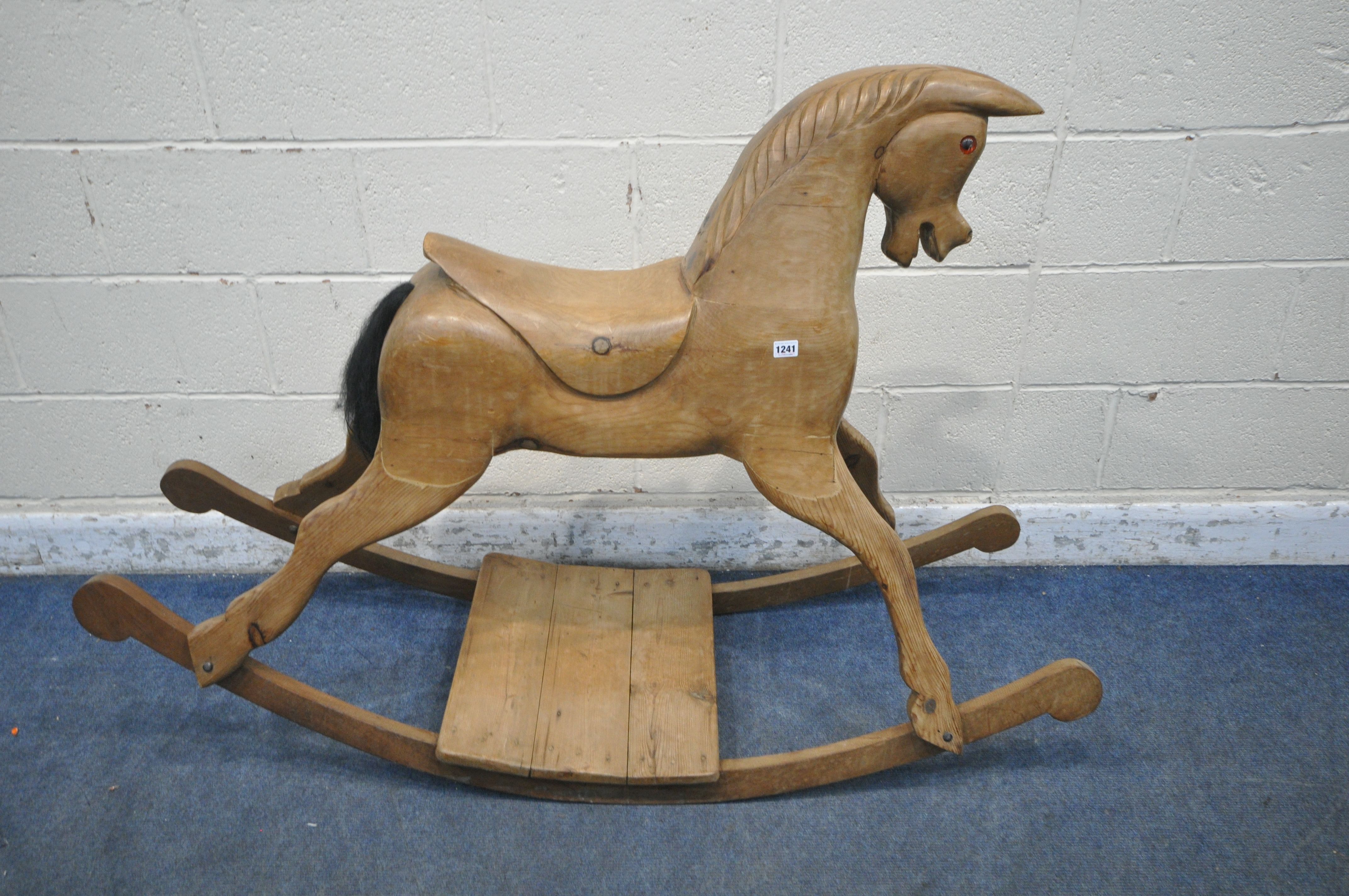 A 20TH CENTURY PINE BOW ROCKING HORSE, with carved mane and saddle, length 148cm (condition