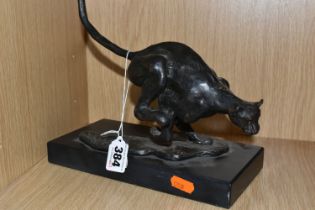 A BRONZED RESIN FIGURE OF A RUNNING CHEETAH, supported by a black marble base, length 25cm x 11.