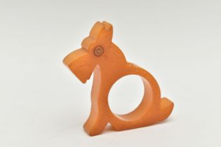 A BAKELITE NAPKIN RING, designed as a butterscotch scotty dog, approximate height 73mm,