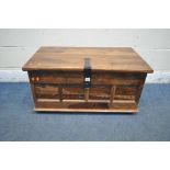 A HARDWOOD BLANKET CHEST, with a hinged lid, twin metal handles, four elephants to front, width 85cm