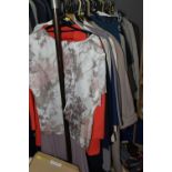 A QUANTITY OF VINTAGE LADIES' CLOTHING mainly in sizes 18-20 to include a selection of suits, coats,