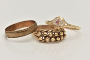 THREE RINGS, the first a yellow gold band ring with milgrain edge detail, approximate width 4.5mm,