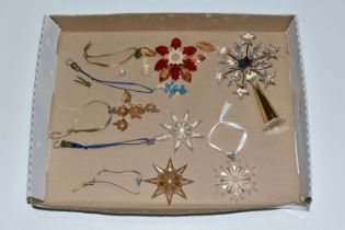 A BOX OF SWAROVSKI CRYSTAL CHRISTMAS ORNAMENTS, comprising a tree topper, 2009 Gold SCS, 2009 Little