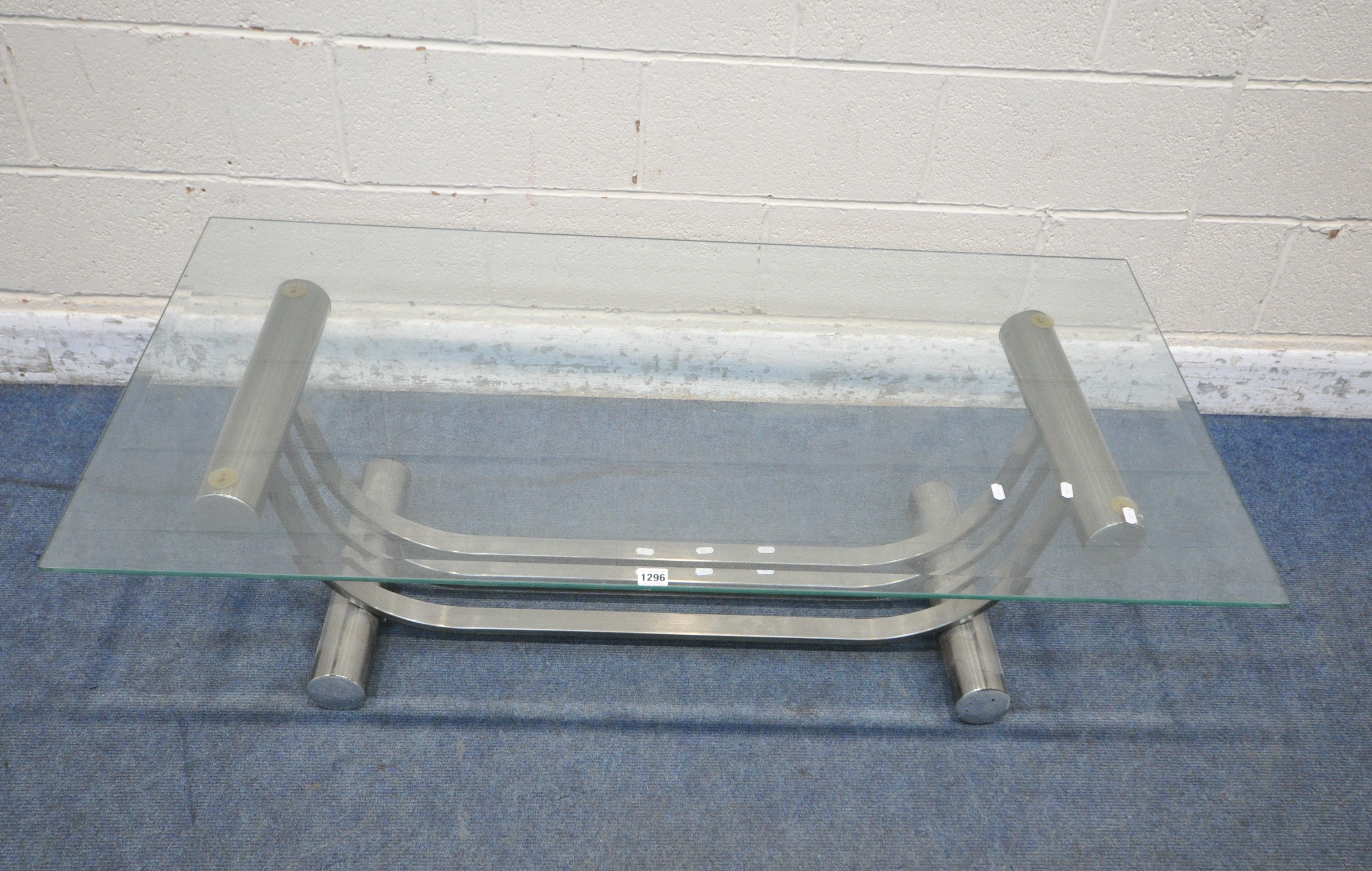 POSSIBLY DIA, AN AMERICAN STYLE ELLIPSE SHAPED COFFEE TABLE, with a bevelled glass top, width