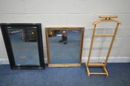 A GILT WOOD RECTANGULAR WALL MIRROR, 87cm x 69cm, a larger bevelled edge wall mirror, along with a