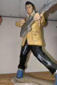 AN ELVIS RESIN DISPLAY STATUE, approximately 92cm height x 66cm width at base, in characteristic