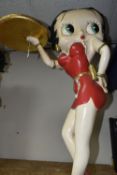 A BETTY BOOP STATUE in the form of a vintage style waitress carrying a gold tray in a red dress, a