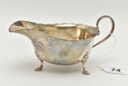 A MAPPIN & WEBB SILVER SAUCE BOAT, on three hoof feet with shaped rim, silver hallmark for