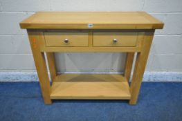 A LIGHT OAK SIDE TABLE with two frieze drawers, raised on block legs, united by an undershelf, width