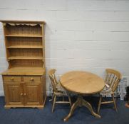 A PINE CIRCULAR KITCHEN TABLE, raised on a turned support and three legs, diameter 91cm x height