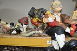 THREE COMPOSITE RESIN CHILDREN'S CHARACTERS, comprising a standing Mickey Mouse, a reclining