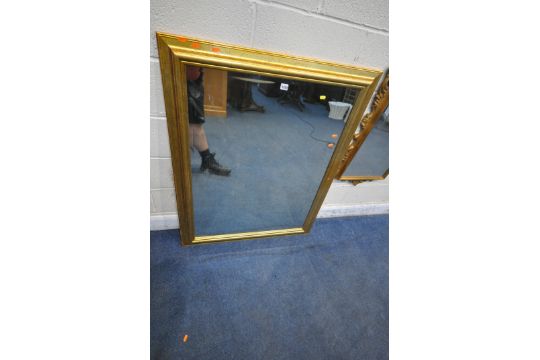 A LARGE RECTANGULAR GILT FRAMED BEVELLED EDGE WALL MIRROR, 118cm x 91cm, a flamboyant gilt mirror, - Image 2 of 4