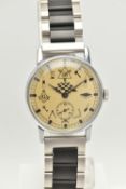A GENTS WRISTWATCH, manual wind watch, round gold tone dial featuring Masonic items and emblems,