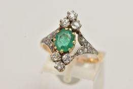 AN 18CT GOLD EMERALD AND DIAMOND DRESS RING, centrally set with an oval cut emerald in an eight claw