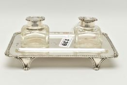 A LATE VICTORIAN SILVER INKSTAND OF RECTANGULAR FORM, foliate scroll and shell cast corners,