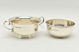 A GEORGE V SILVER TWIN HANDLED PORRIDGE BOWL AND ANOTHER GEORGE V SILVER PORRIDGE BOWL WITHOUT