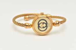 A 'GUCCI' WRISTWATCH, quartz movement, gold tone dial with a double G logo, gold plated case,