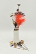 A COLLECTION OF HAT PINS WITH STAND, various designs to the terminals, including a ceramic stand