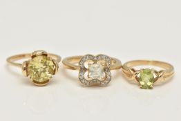 THREE 9CT GOLD GEM SET RINGS, the first a circular cut citrine ring, ring size N, the second an oval