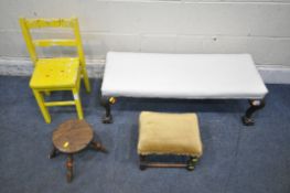 AN EARLY 20TH CENTURY LONG FOOTSTOOL, on ball and claw feet, length 95cm, an elm milking stool,