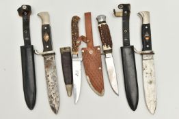 FOUR GERMAN DAGGERS WITH SCABBARDS, to include a C. Jul Herbertz of Solingen dagger with scabbard,