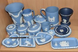 A GROUP OF WEDGWOOD BLUE JASPERWARE, comprising a paper knife, six trinket dishes, a Christmas