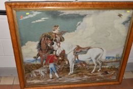 A VICTORIAN NEEDLEPOINT TAPESTRY, depicting a Lord on his horse together with his servant and
