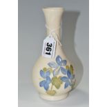 A MOORCROFT POTTERY 'BLUE CAMPANULA' BUD VASE, tube lined with pale blue campanula flowers on a